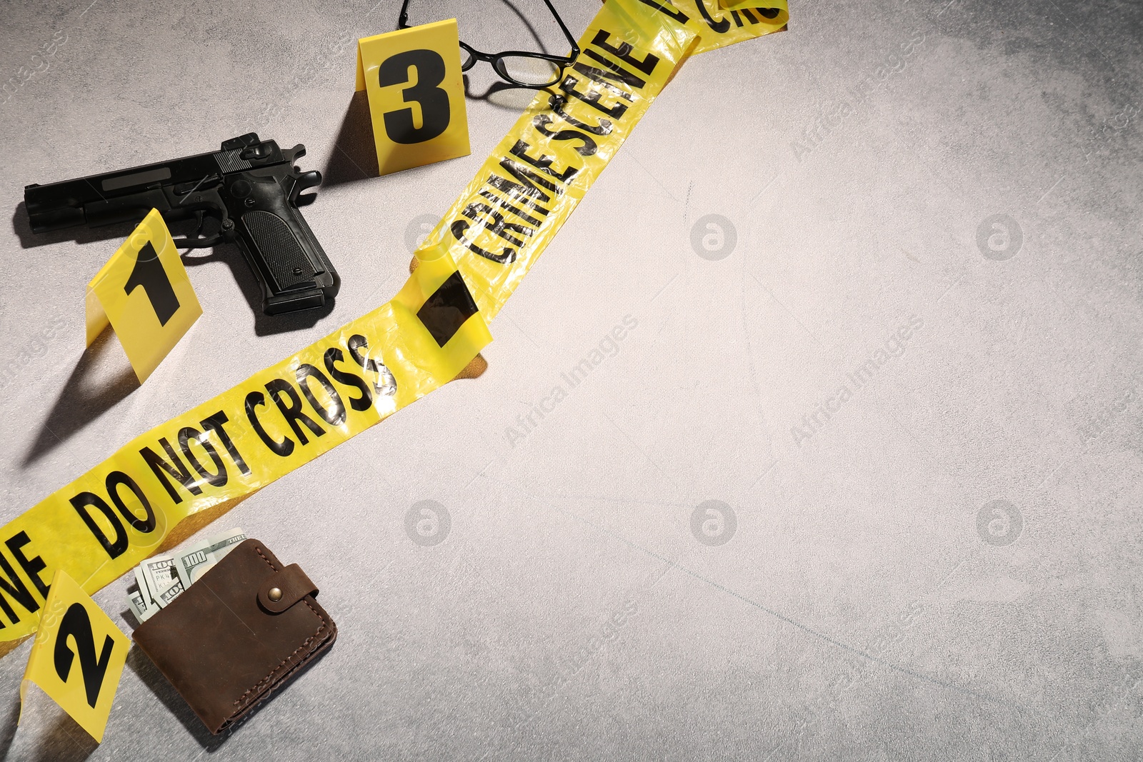 Forensic expertise. Crime scene with evidence, markers and police tape on light grey background, flat lay. Space for text Photo of Forensic expertise. Crime scene with evidence, markers and police tape on light grey background, flat lay. Space for text