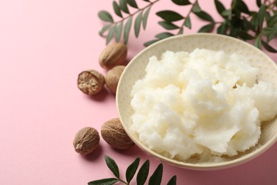 Photo of Natural shea butter on pink background, closeup