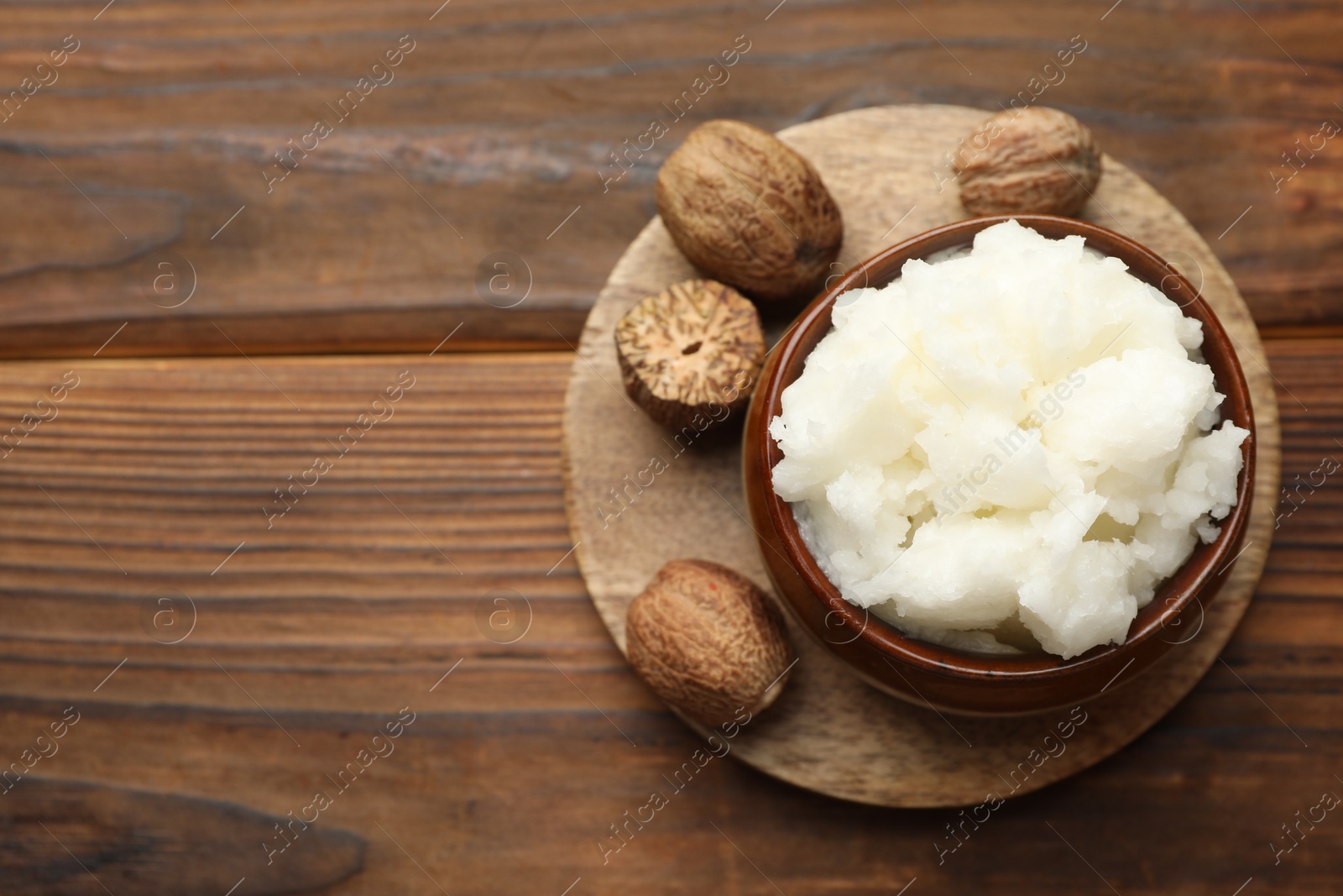 Natural shea butter on wooden table, top view. Space for text Photo of Natural shea butter on wooden table, top view. Space for text