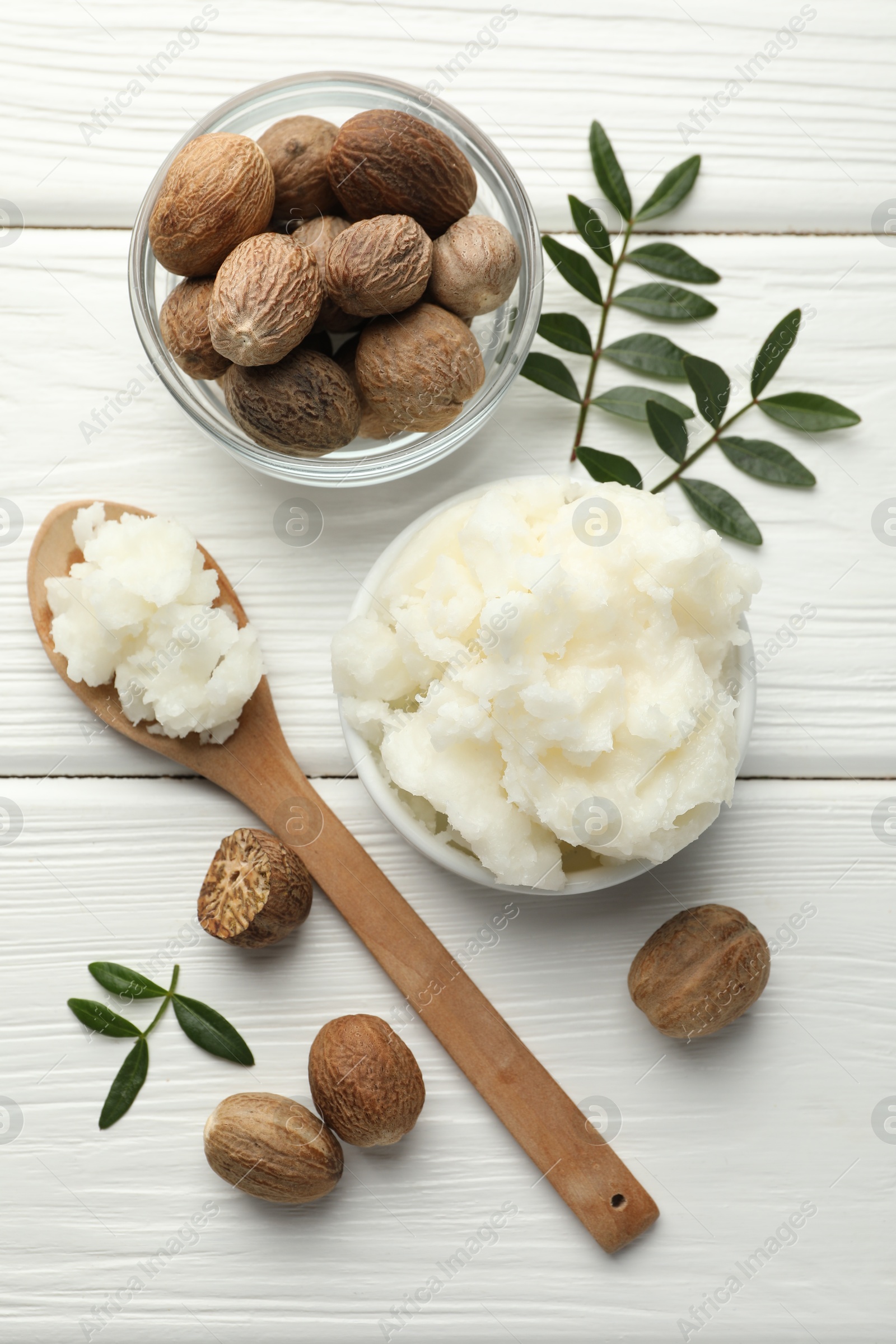 Natural shea butter on white wooden table, flat lay Photo of Natural shea butter on white wooden table, flat lay