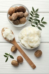 Photo of Natural shea butter on white wooden table, flat lay