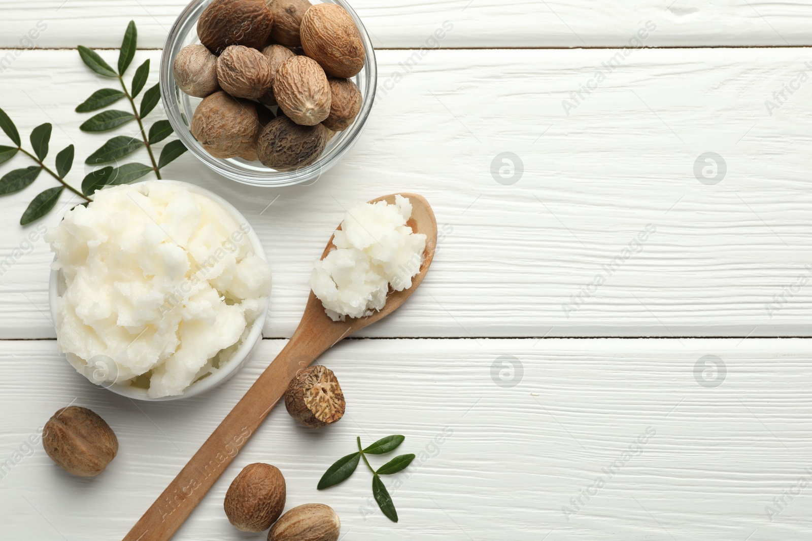Natural shea butter on white wooden table, flat lay. Space for text Photo of Natural shea butter on white wooden table, flat lay. Space for text