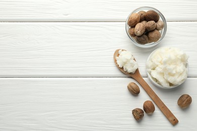 Photo of Natural shea butter on white wooden table, flat lay. Space for text