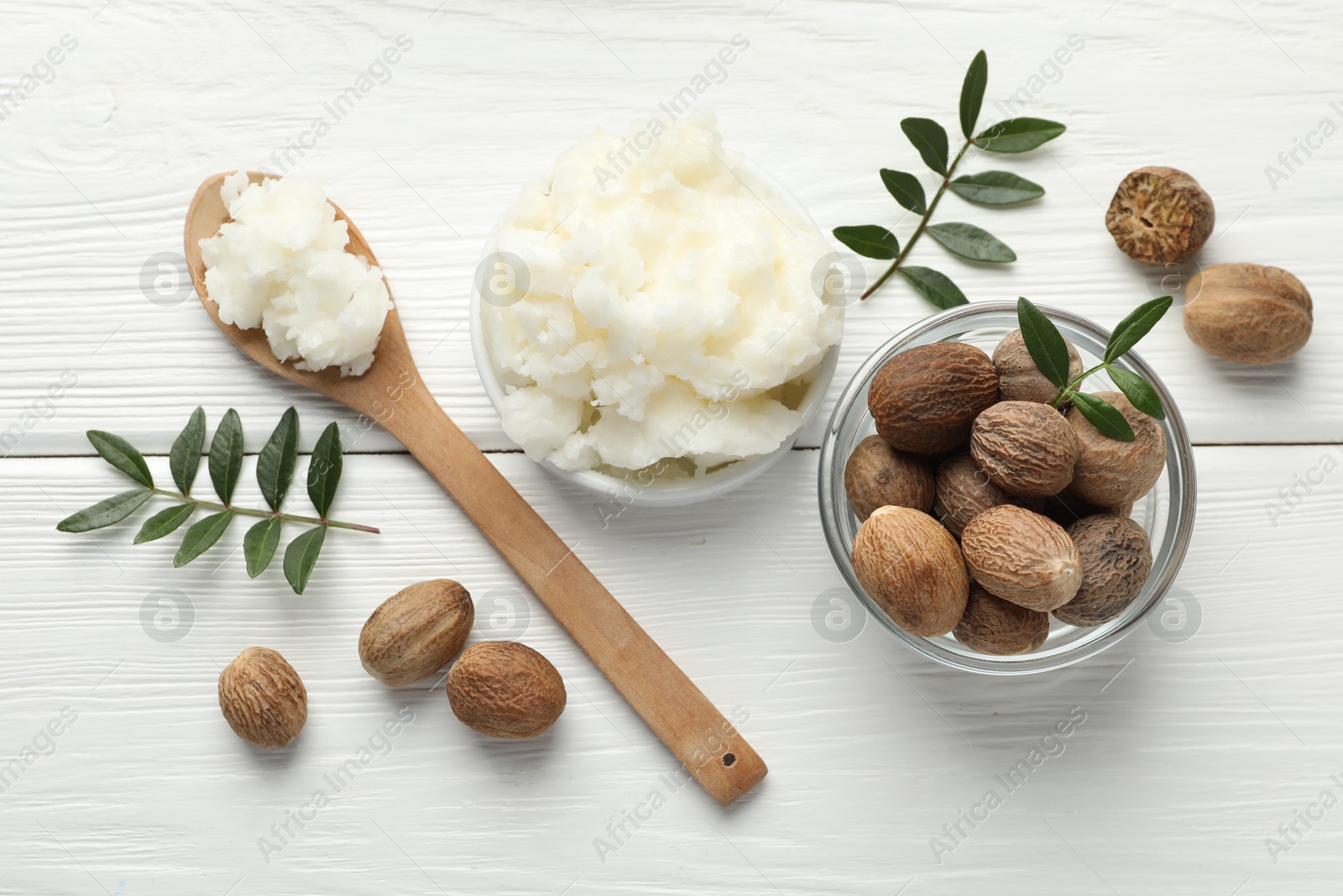 Natural shea butter on white wooden table, flat lay Photo of Natural shea butter on white wooden table, flat lay
