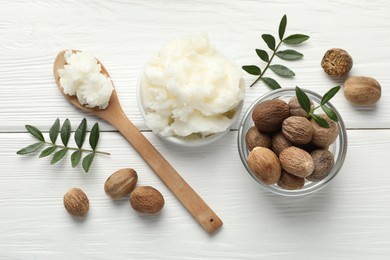 Photo of Natural shea butter on white wooden table, flat lay