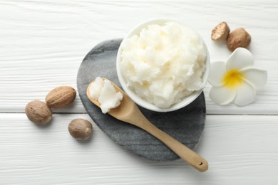 Photo of Natural shea butter on white wooden table, flat lay