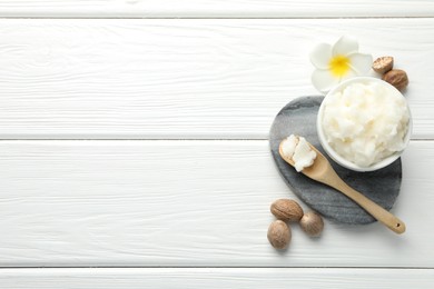 Photo of Natural shea butter on white wooden table, flat lay. Space for text