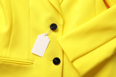 Photo of Cardboard tag on yellow jacket, top view