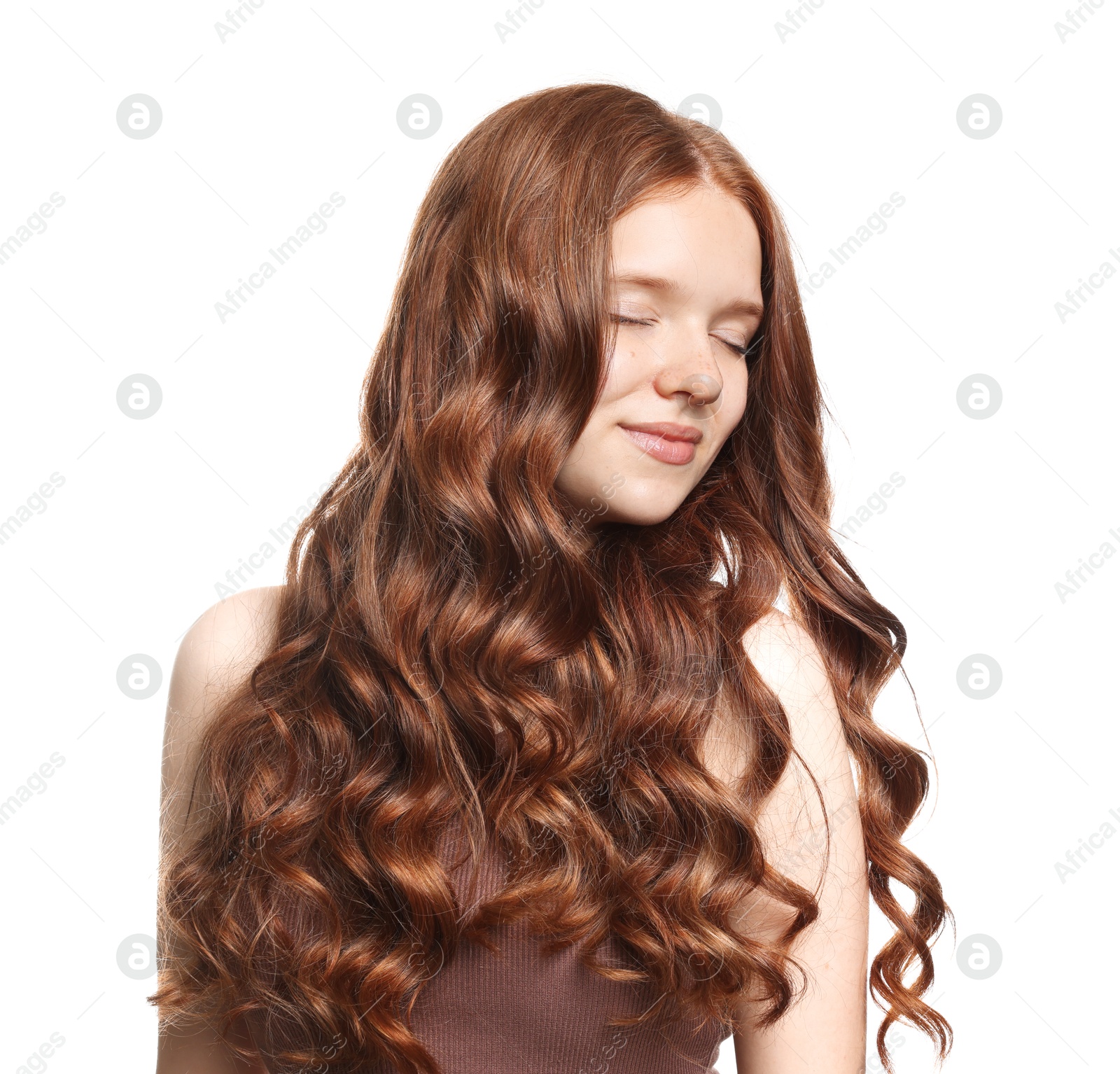 Teenage girl with healthy wavy hair on white background Photo of Teenage girl with healthy wavy hair on white background