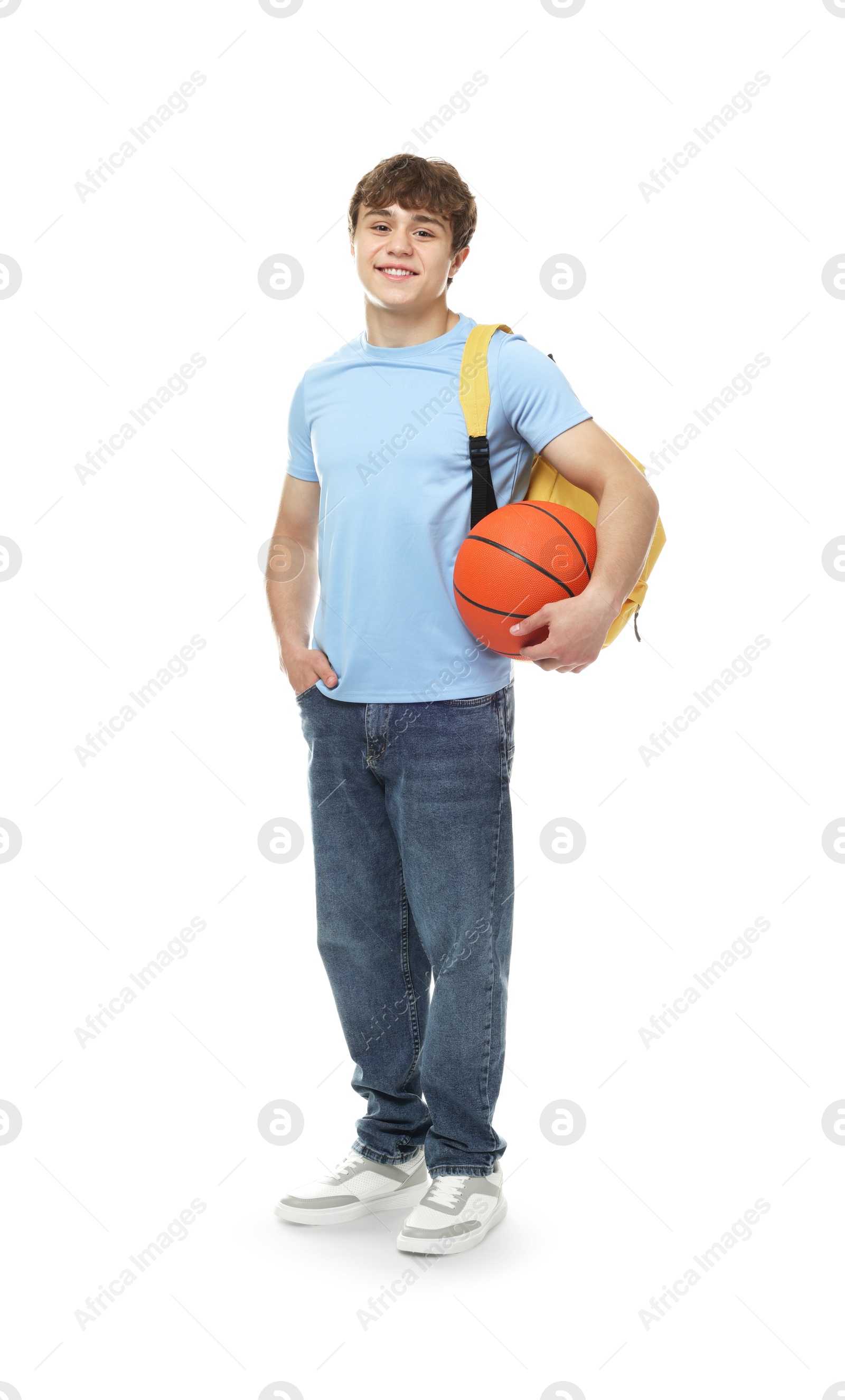 Teenage boy with basketball on white background Photo of Teenage boy with basketball on white background