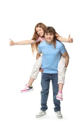 Photo of Teenage girl and boy having fun on white background