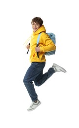 Photo of Happy teenage boy jumping on white background