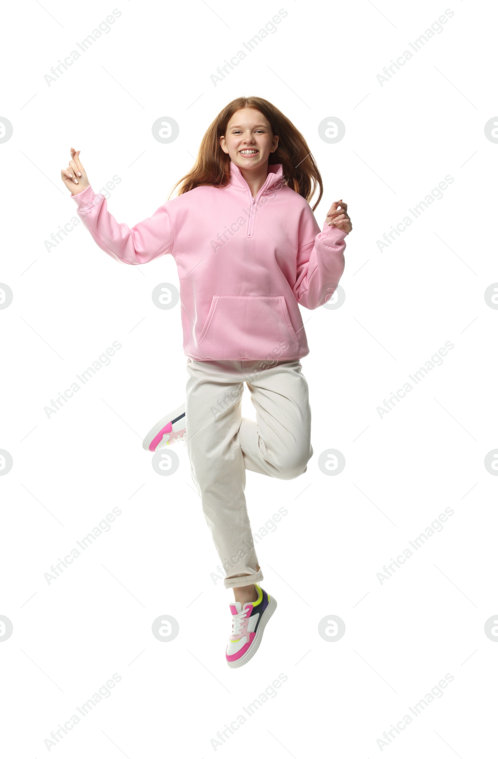 Happy teenage girl jumping on white background Photo of Happy teenage girl jumping on white background