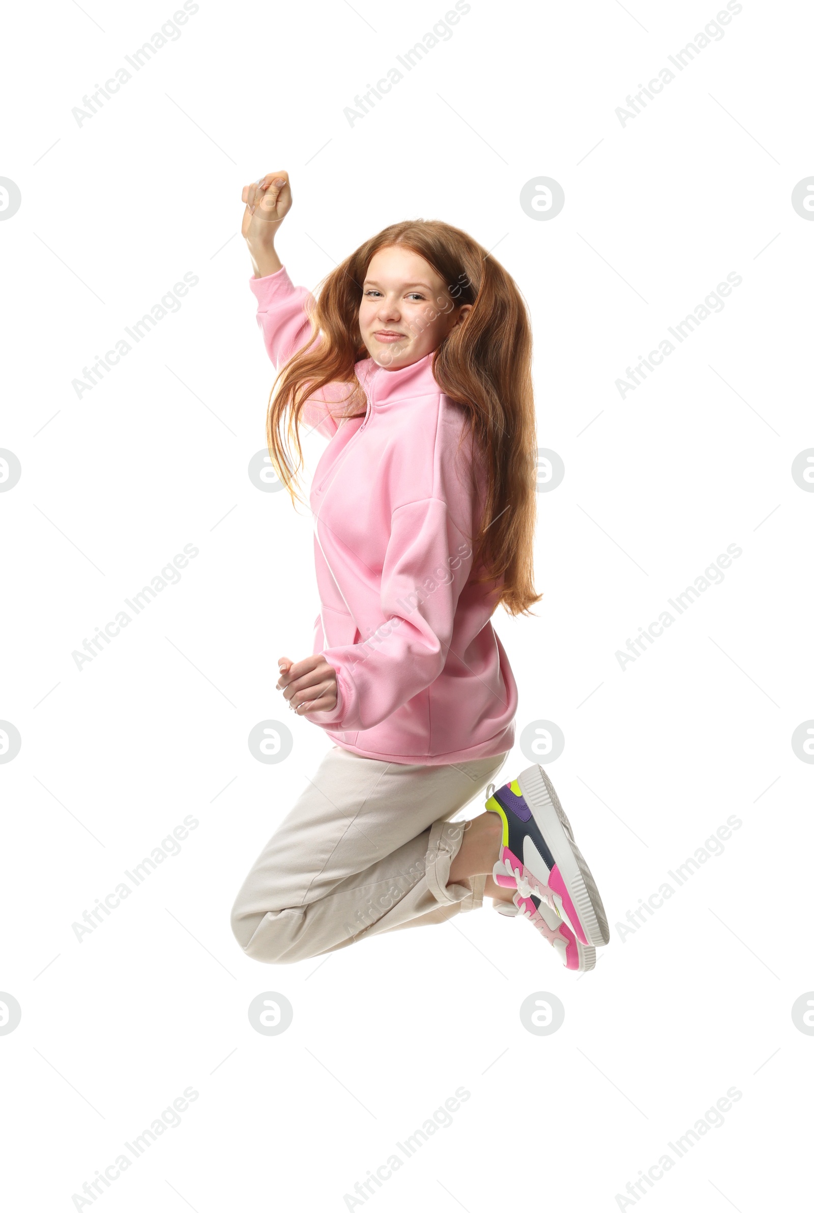 Happy teenage girl jumping on white background Photo of Happy teenage girl jumping on white background