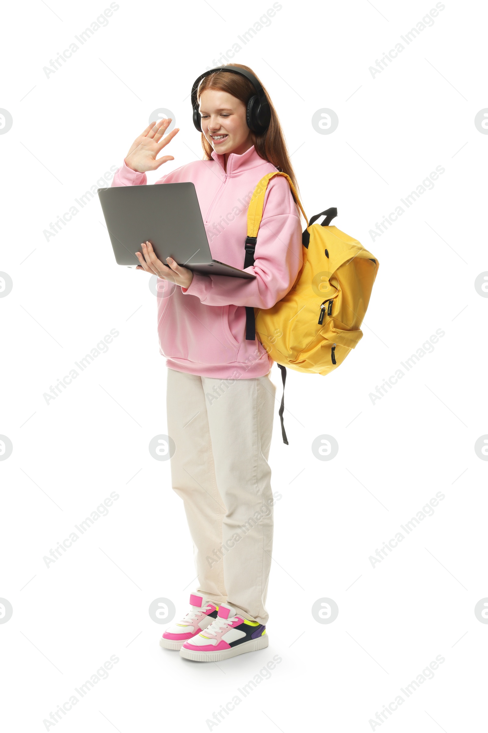 Teenage girl waving during video call on white background Photo of Teenage girl waving during video call on white background