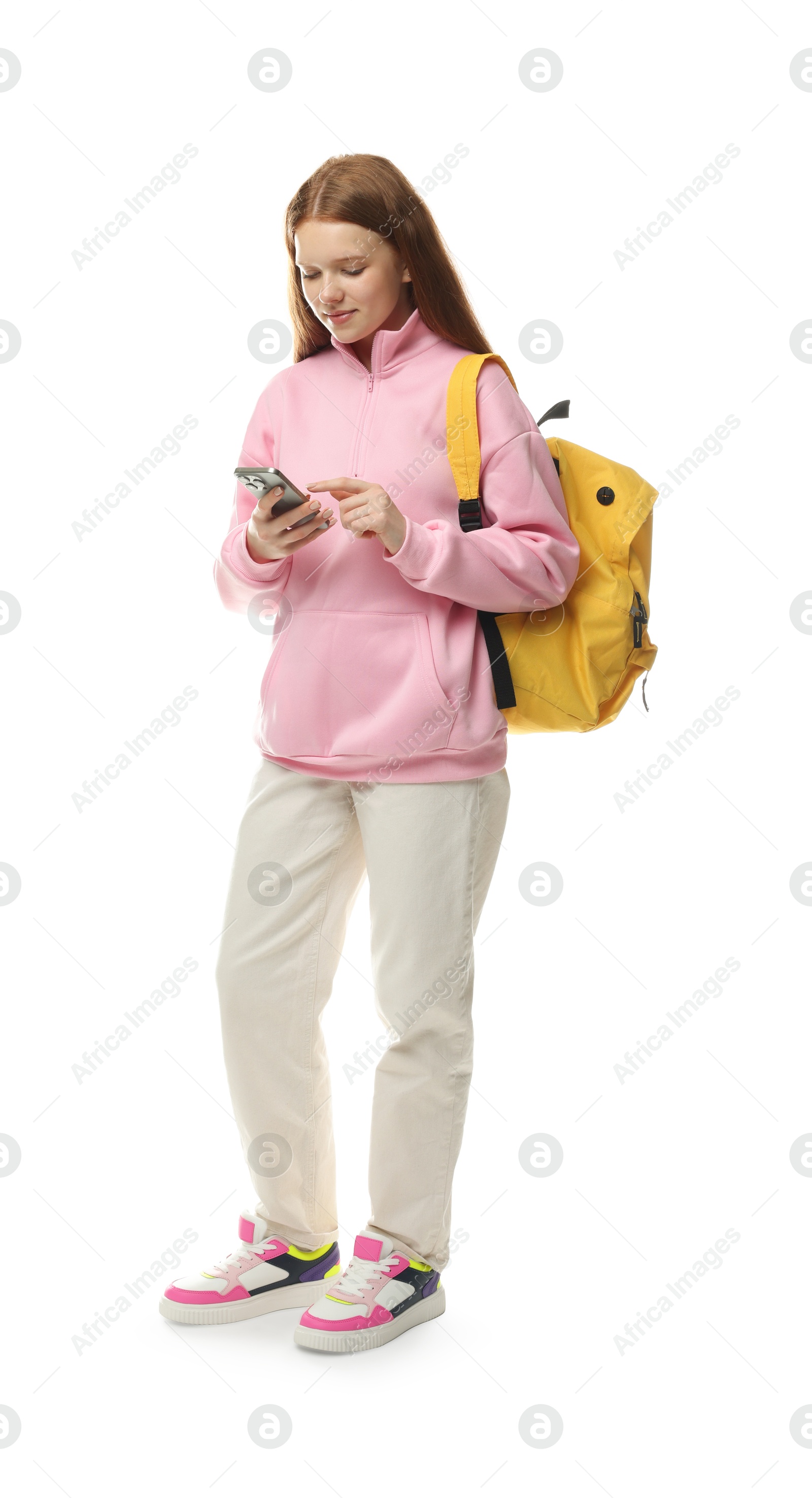 Teenage girl with smartphone and backpack on white background Photo of Teenage girl with smartphone and backpack on white background