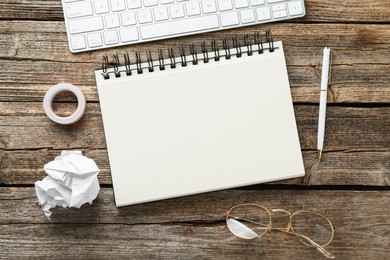 Photo of Flat lay composition with notebook on wooden table