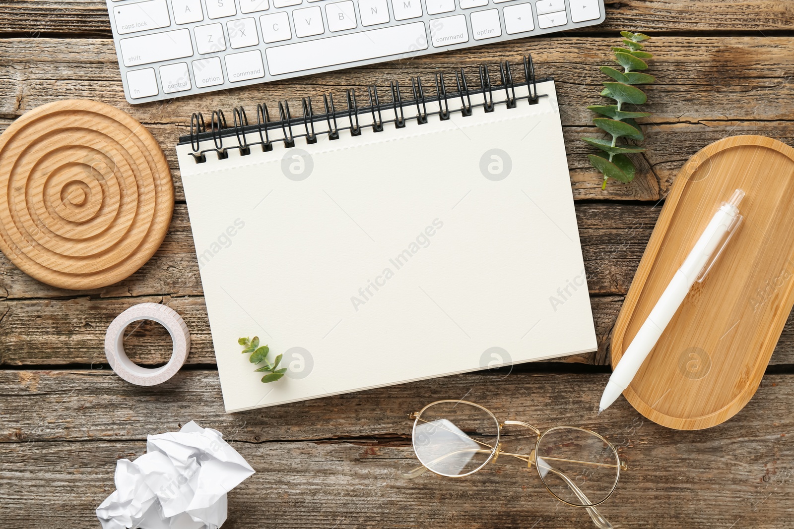 Photo of Flat lay composition with notebook on wooden table