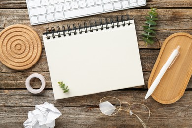 Photo of Flat lay composition with notebook on wooden table