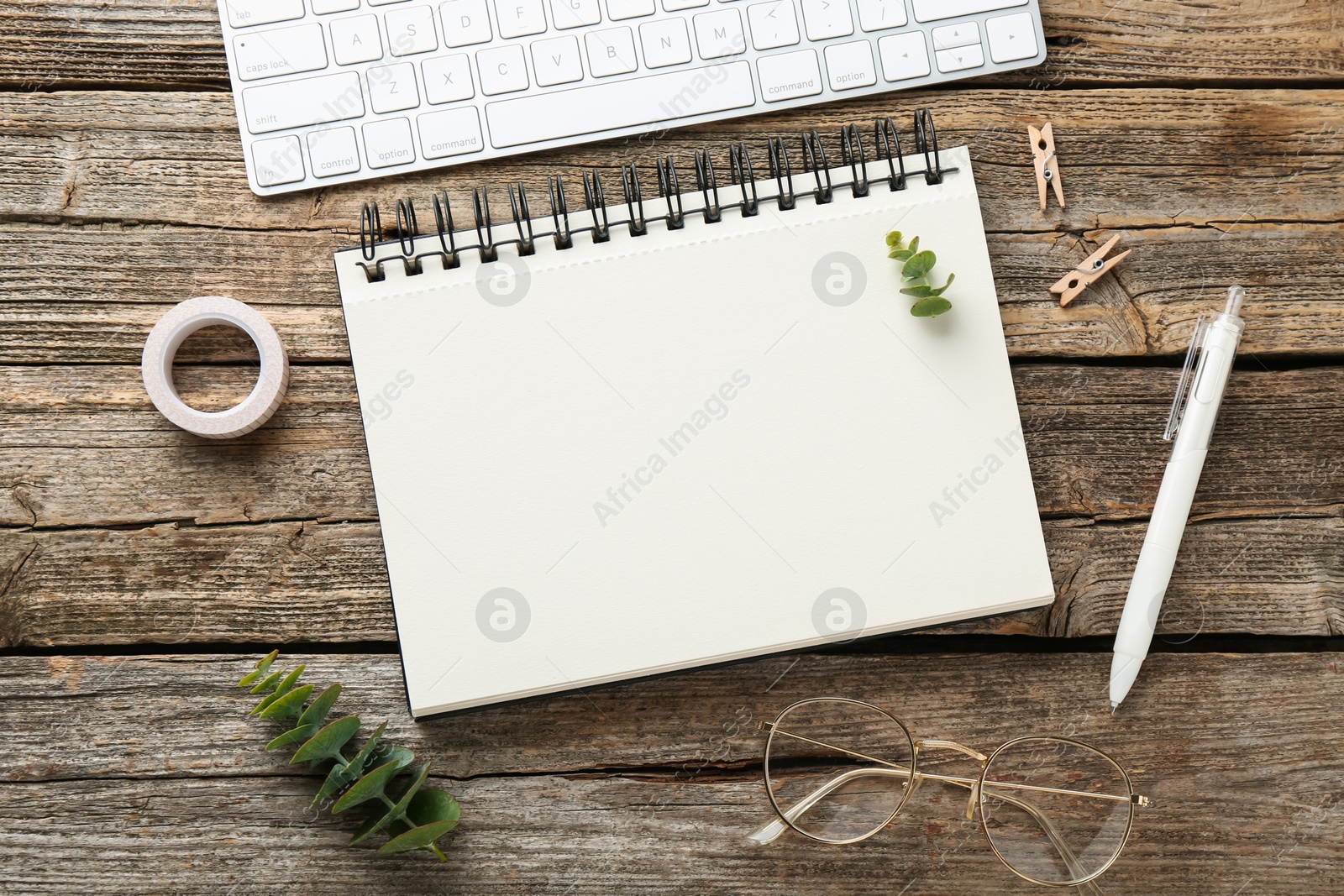 Photo of Flat lay composition with notebook on wooden table