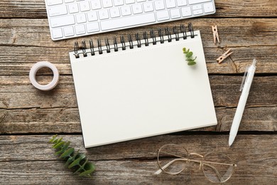 Photo of Flat lay composition with notebook on wooden table