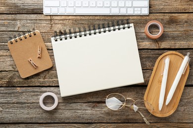 Photo of Flat lay composition with notebook on wooden table