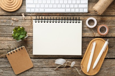 Photo of Flat lay composition with notebook on wooden table