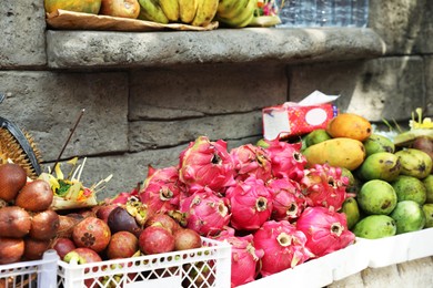 Photo of Many fresh exotic fruits at market, closeup