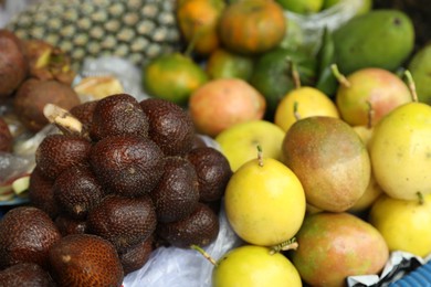 Photo of Different fresh exotic fruits at market, closeup