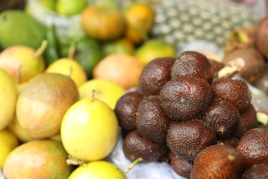 Photo of Different fresh exotic fruits at market, closeup