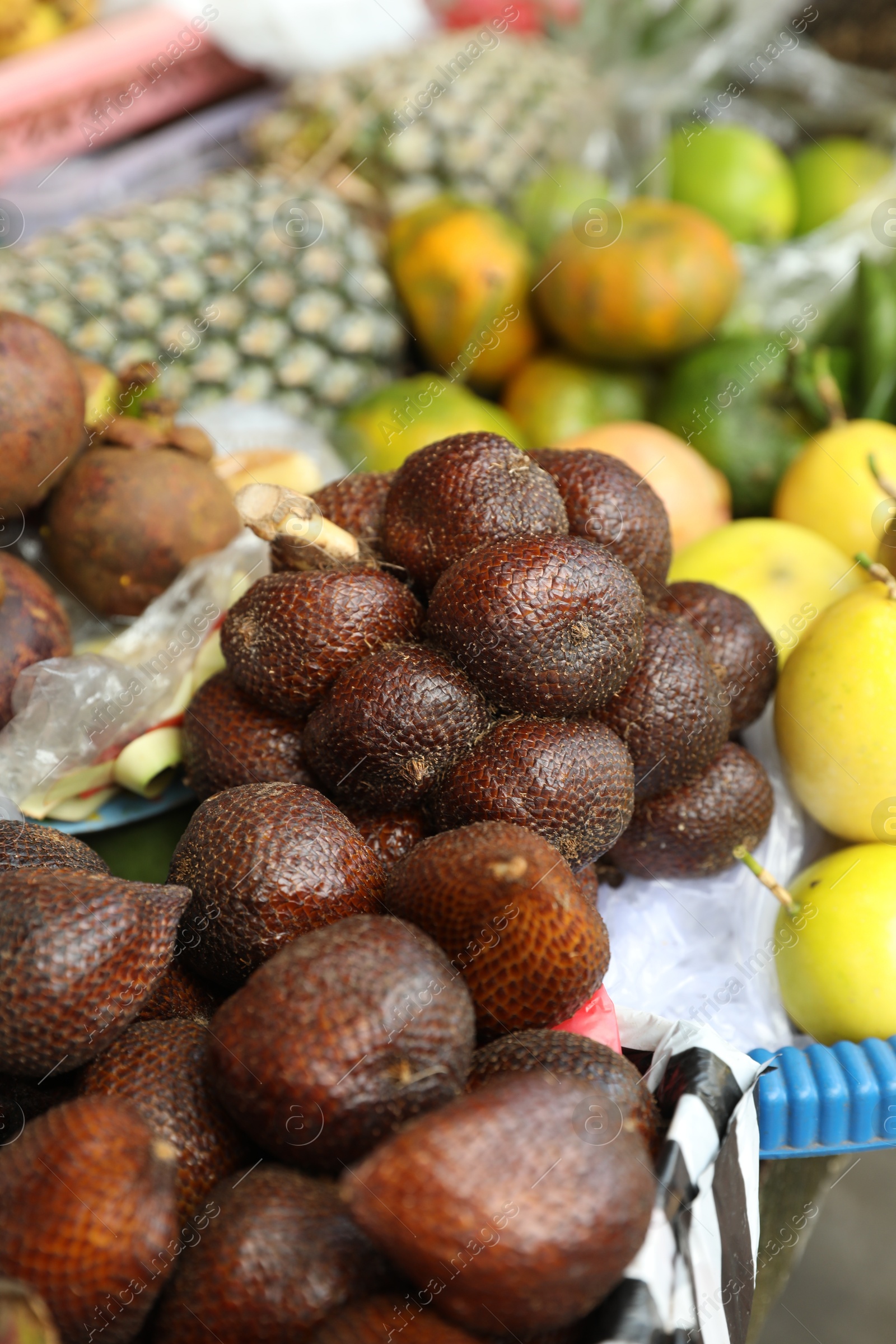 Different fresh exotic fruits at market, closeup Photo of Different fresh exotic fruits at market, closeup