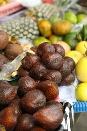 Photo of Different fresh exotic fruits at market, closeup