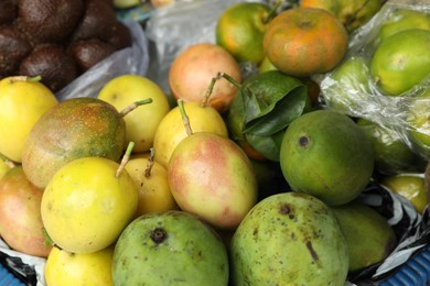 Photo of Different fresh exotic fruits at market, closeup