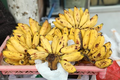 Photo of Many fresh ripe bananas at market, closeup