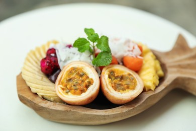 Photo of Different fresh fruits on white table, closeup