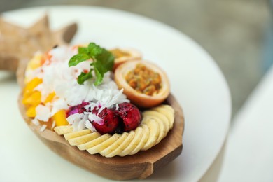 Photo of Different fresh fruits on white table, closeup. Space for text