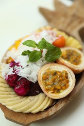 Photo of Different fresh fruits on white table, closeup