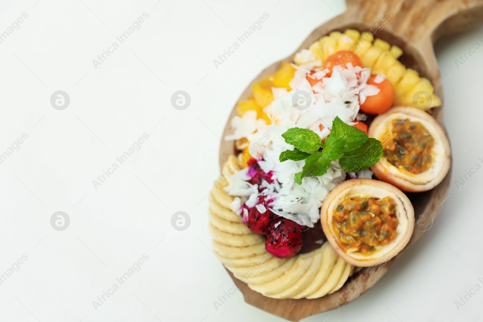 Different fresh fruits on white table, above view. Space for text Photo of Different fresh fruits on white table, above view. Space for text