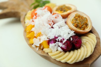 Photo of Different fresh fruits on white table, closeup