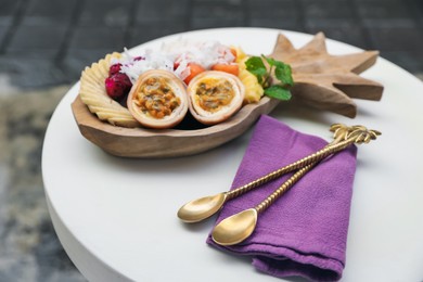 Photo of Different fresh fruits on white table, closeup