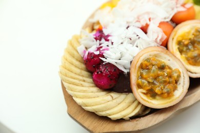 Photo of Different fresh fruits on white table, closeup. Space for text
