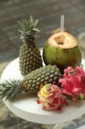 Photo of Different fresh fruits on white table outdoors