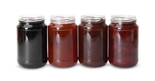 Photo of Different sweet jams in jars isolated on white