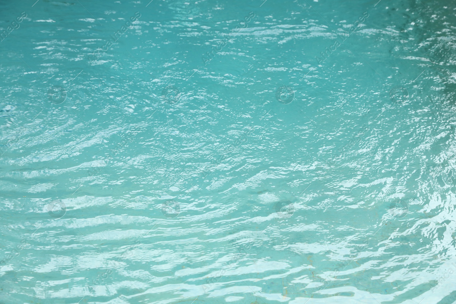 Clear water with ripples in outdoor swimming pool Photo of Clear water with ripples in outdoor swimming pool