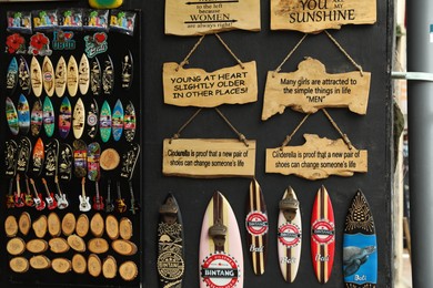Photo of Bali, Indonesia - May 15, 2025: Display with different souvenirs at local gift shop