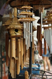 Photo of Different wind chimes in outdoor souvenir shop