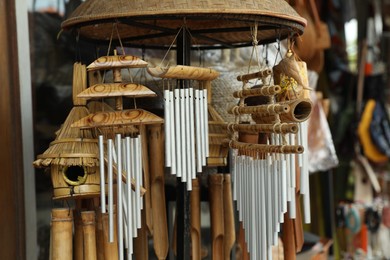 Photo of Different wind chimes in outdoor souvenir shop
