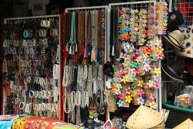 Photo of Many different accessories in outdoor souvenir shop