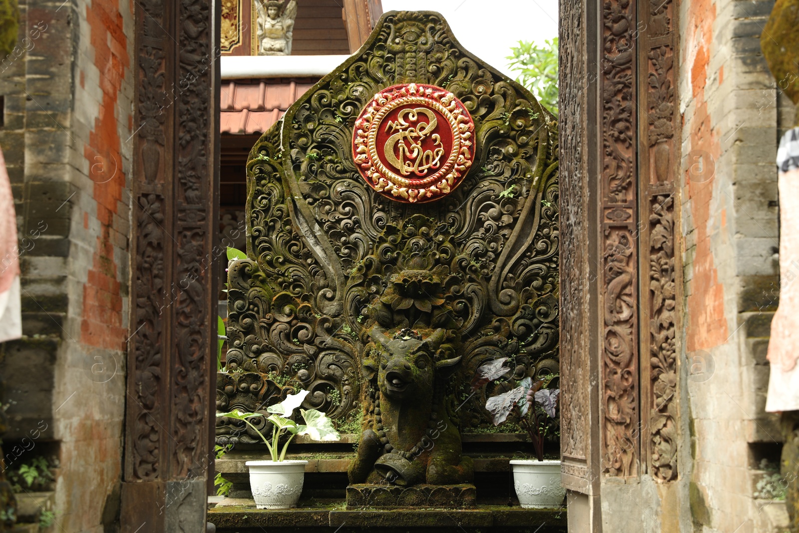 Bali, Indonesia - May 15, 2025: Beautiful ancient ornate sculpture on city street Photo of Bali, Indonesia - May 15, 2025: Beautiful ancient ornate sculpture on city street