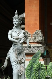 Photo of Bali, Indonesia - May 15, 2025: Beautiful ancient sculpture outdoors